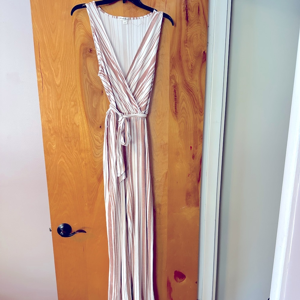 Cream and tan Derek and Heart stripped jumpsuit. Size Large